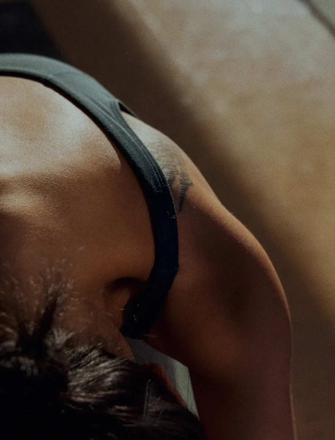 Close-up of someone stretching forward, seen from above